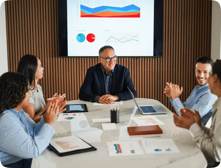 Team applauding during a business presentation